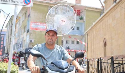 Kırşehir'de sıcaktan bunalan vatandaş, elektrikli motoruna vantilatör taktı